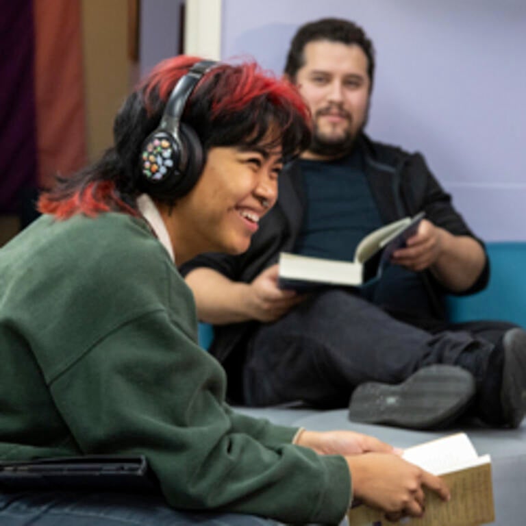 Students with open books smile during a discussing at the LGBTRC